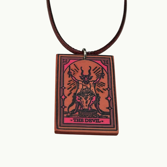 DTB Alchemy handmade matte polymer clay The Devil tarot card pendant necklace with red orange and black ink detailing.